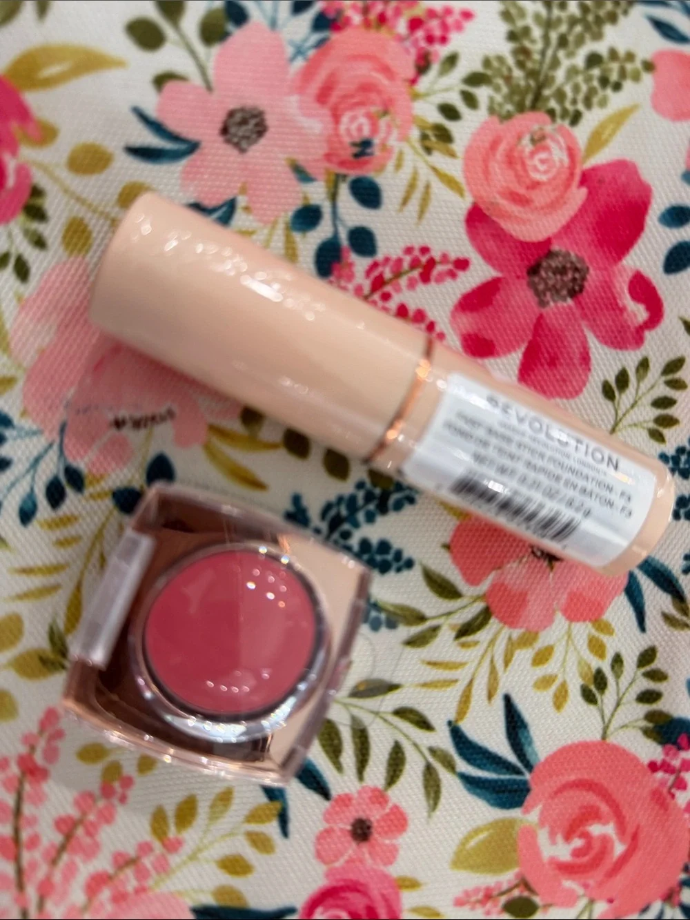Revolution Pink Cream Blush Stick & Pot Duo, cosmetic bag, and foundation stick